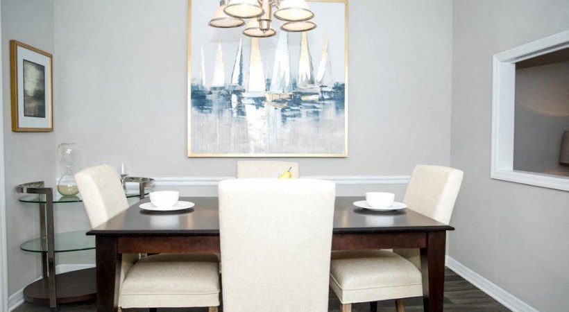 a dining room with a table and chairs