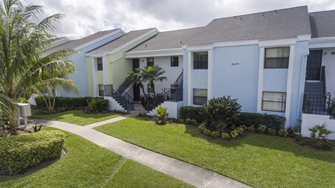A row of houses with a pathway between them.