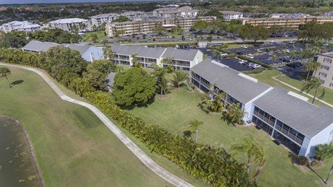 A large building with a parking lot in front of it.