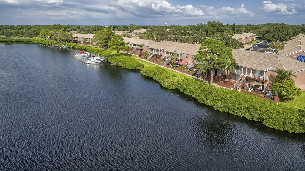 a view from above of a body of water with houses next to it