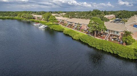 a view from above of a body of water with houses next to it