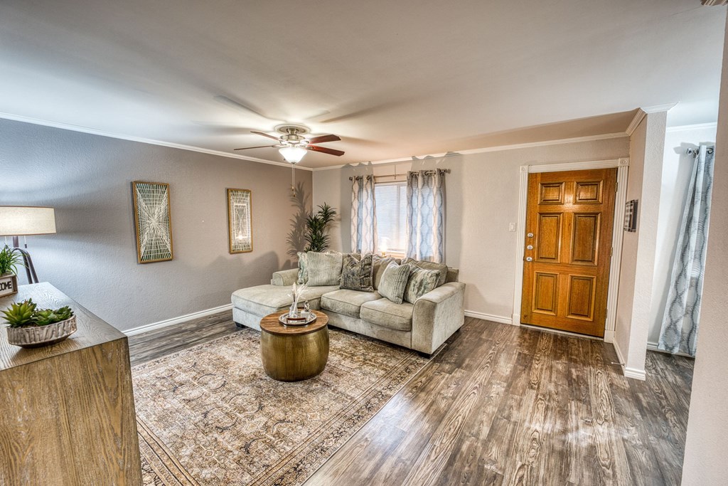 an empty room with a pot on the floor