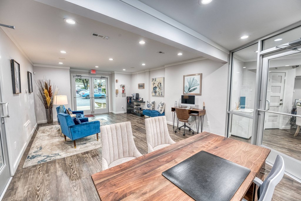 a dining room and living room with a table and chairs