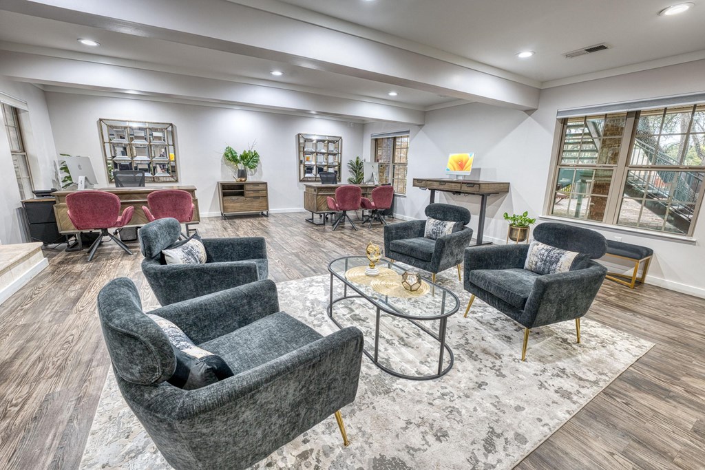 a living room with couches and chairs and a table