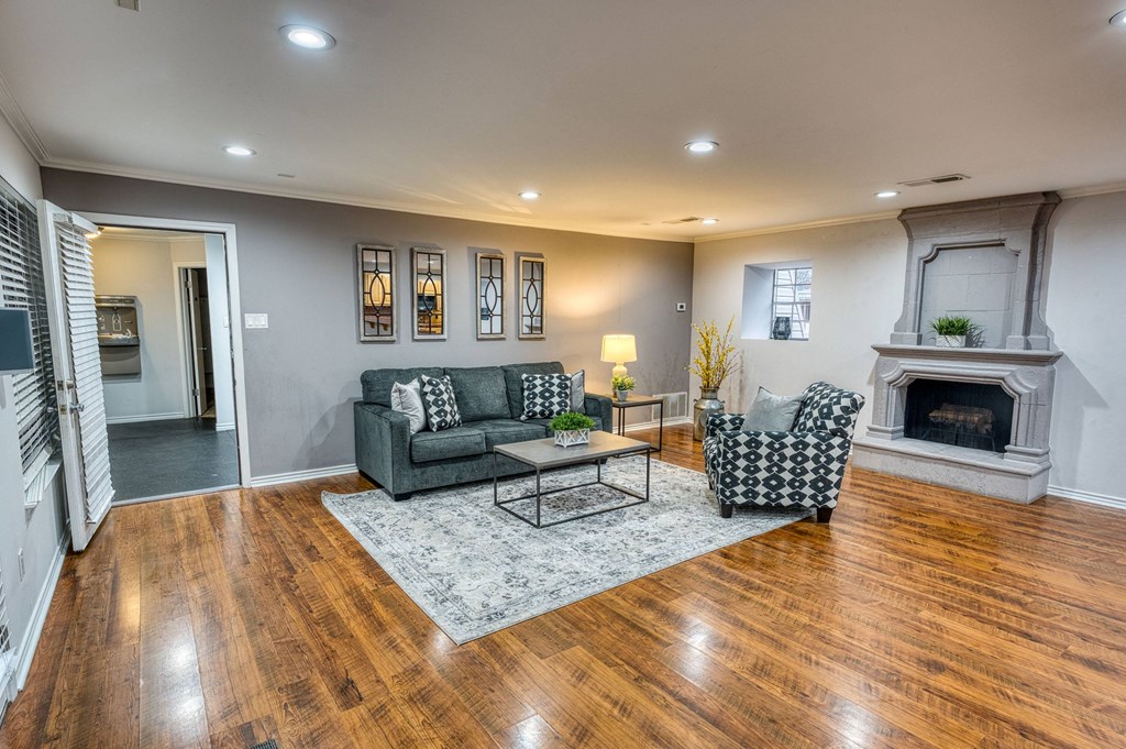 a living room with a fireplace and couches