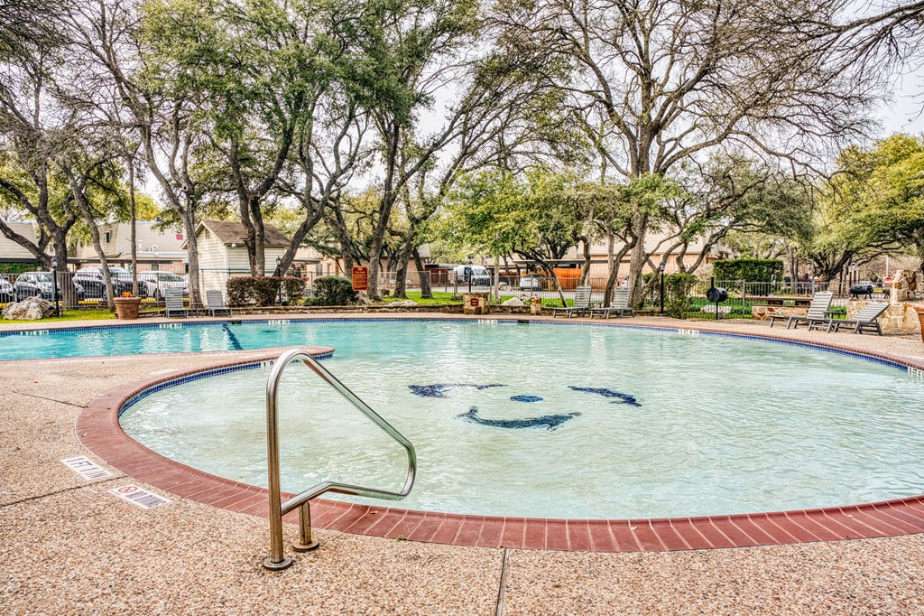 a swimming pool with a smiley face in the middle of it