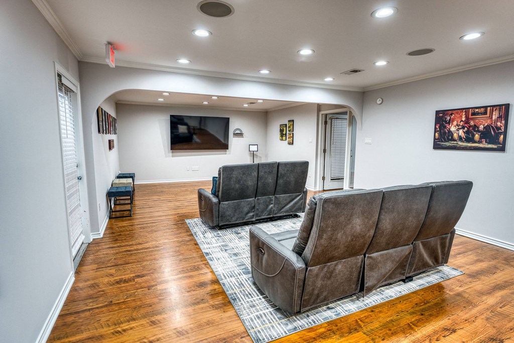 a living room with two couches and a tv