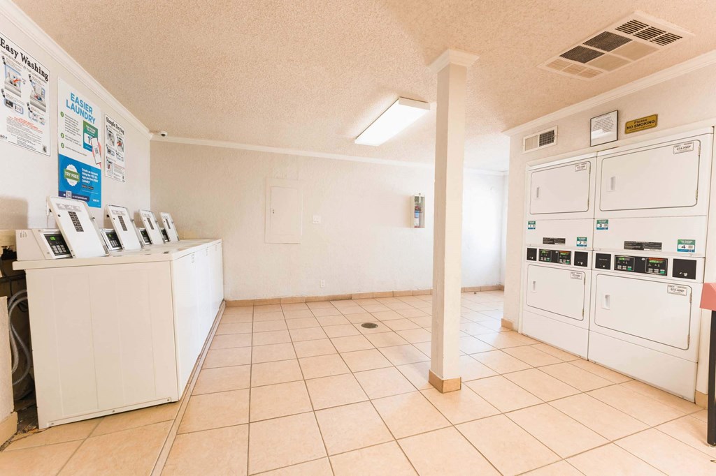 a laundry room with a washer and dryer  at Cantera Apartments, El Paso TX 79935