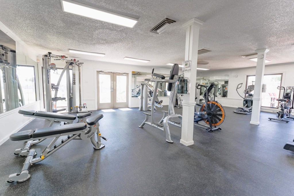 a workout room with weights and other exercise equipment  at Cantera Apartments, El Paso TX 79935