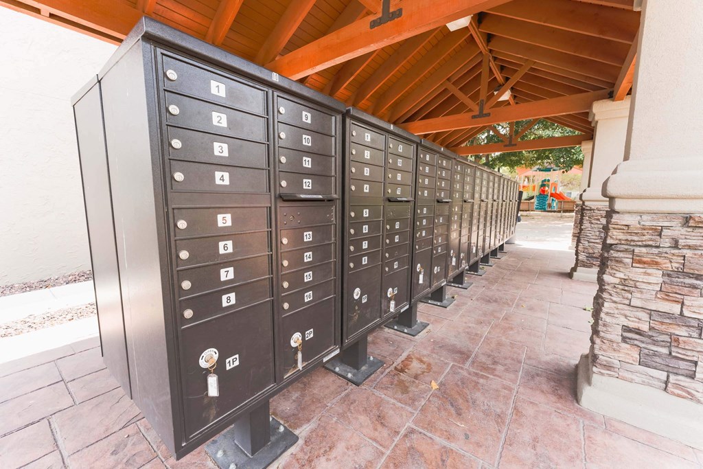 a line of mailboxes on a brick walkway  at Cantera Apartments, El Paso TX 79935