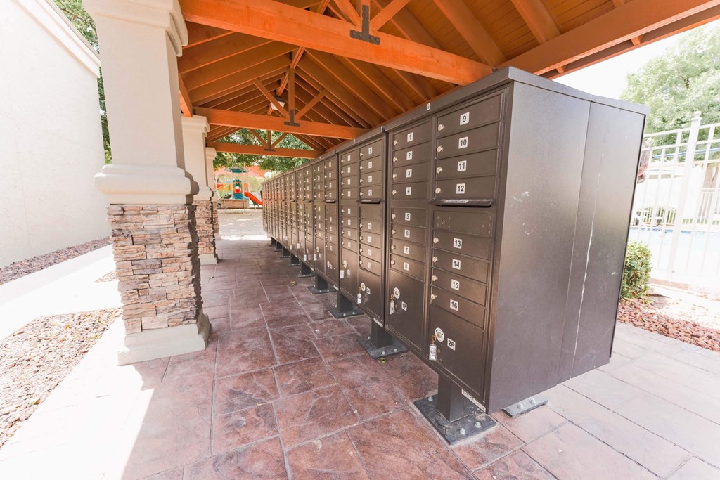 a line of mailboxes on the side of a building