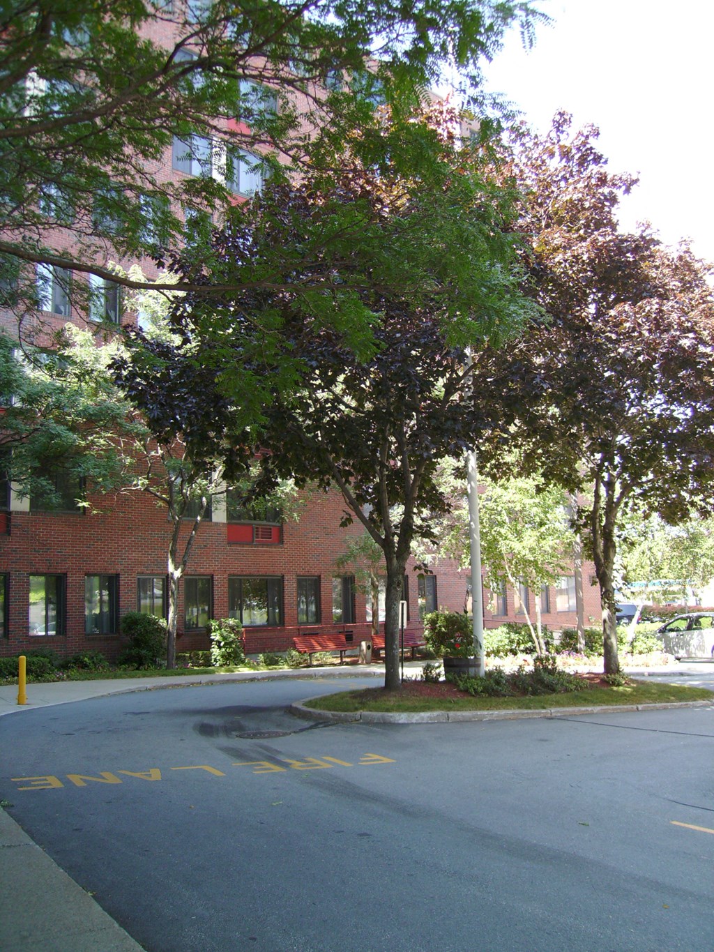 an empty street in front of a brick building