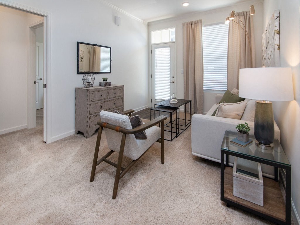 a living room with a couch and a chair at Ardmore at the Trail, Indian Trail, NC