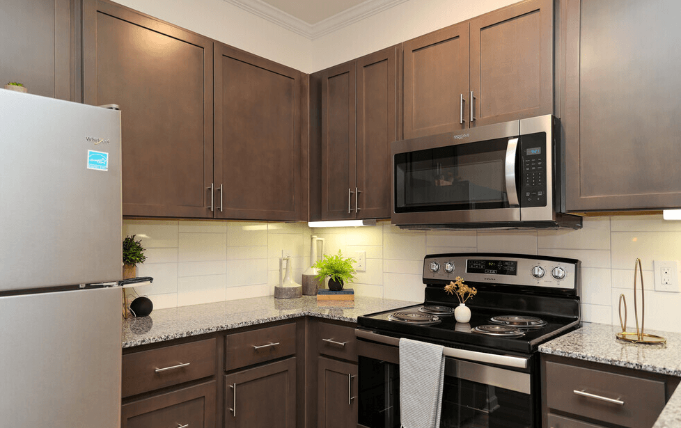 a kitchen with a stove microwave and refrigerator at Ardmore at Bryton, Huntersville