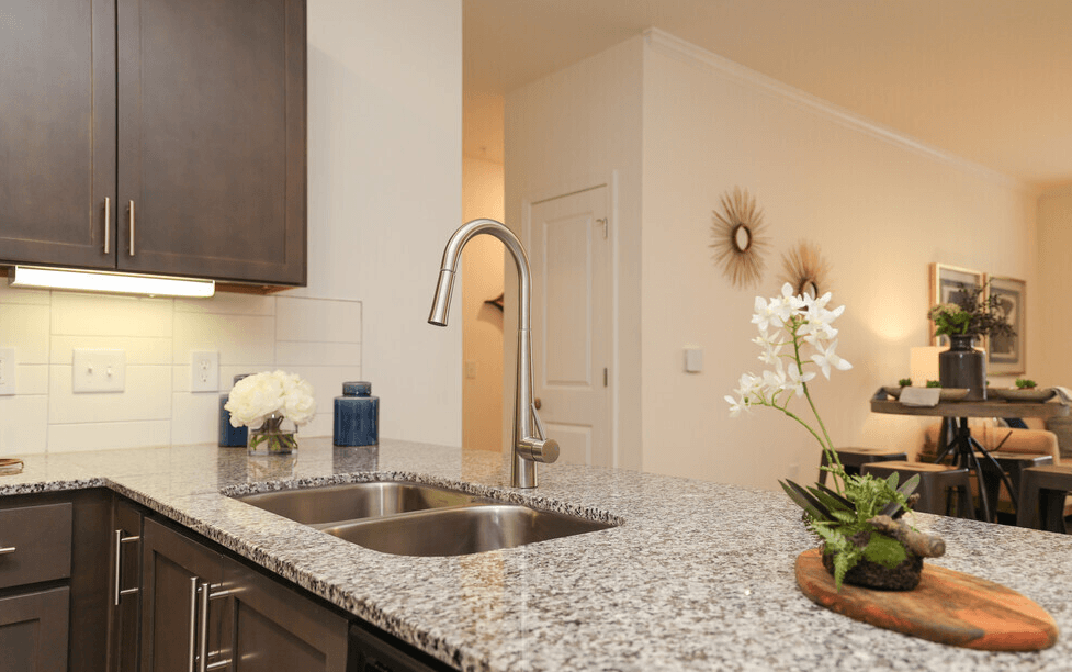 a kitchen with granite counter tops and a sink