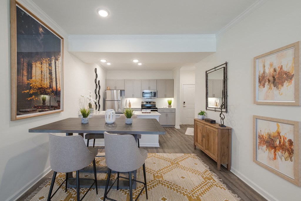 an open kitchen and dining room with a table and chairs