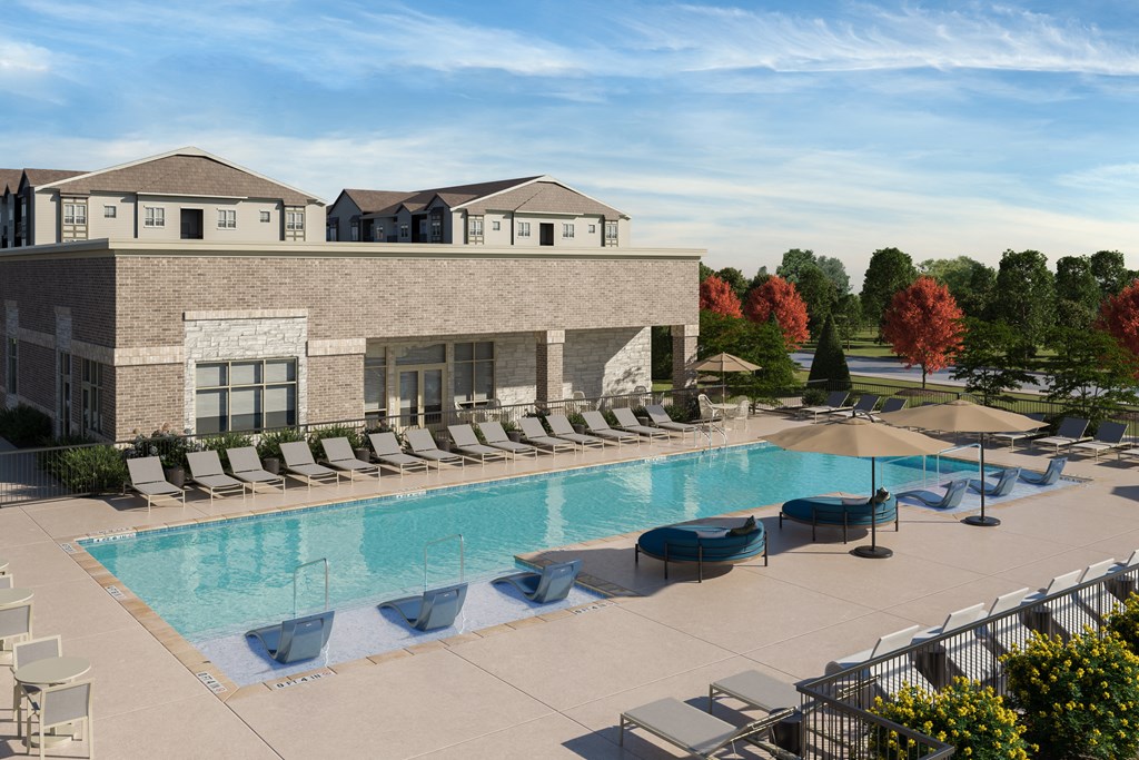 Resort style pool with lounge chairs and umbrellas at Ardmore at Topside in Louisville, TN 37777