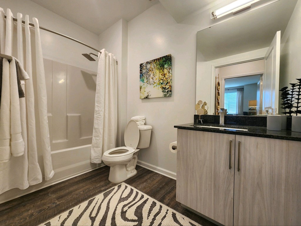 White bathroom with a zebra rug and a toilet at Ardmore at Topside in Louisville, TN 37777