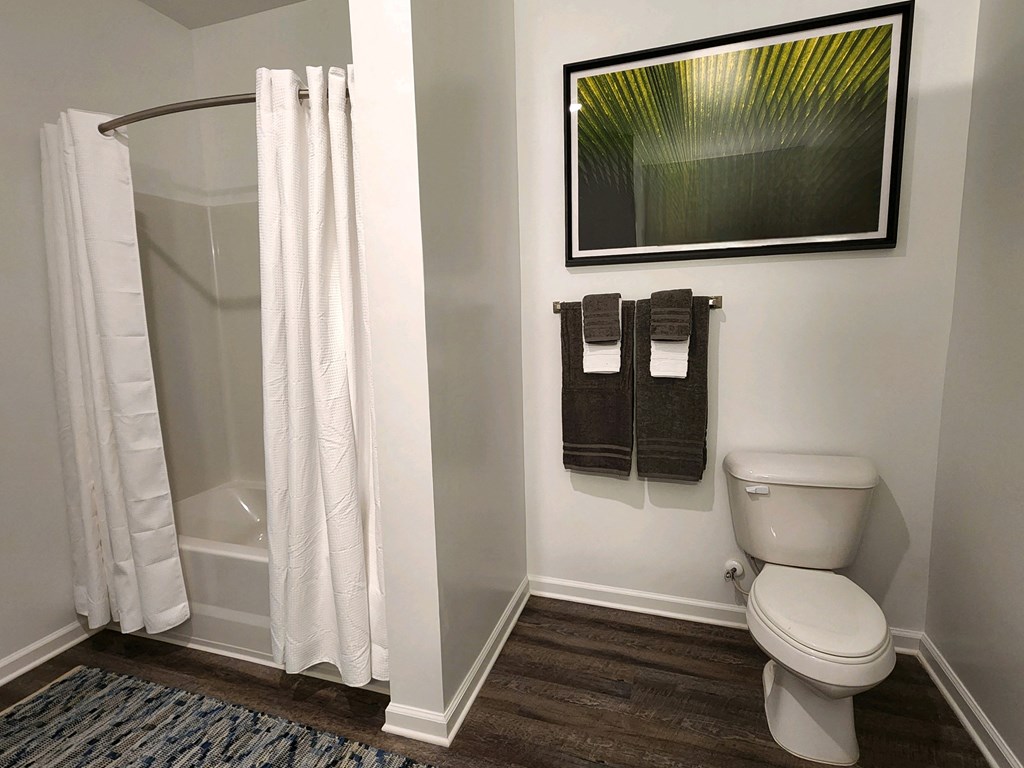 Bathroom with a toilet and a shower and towel racks at Ardmore at Topside in Louisville, TN 37777