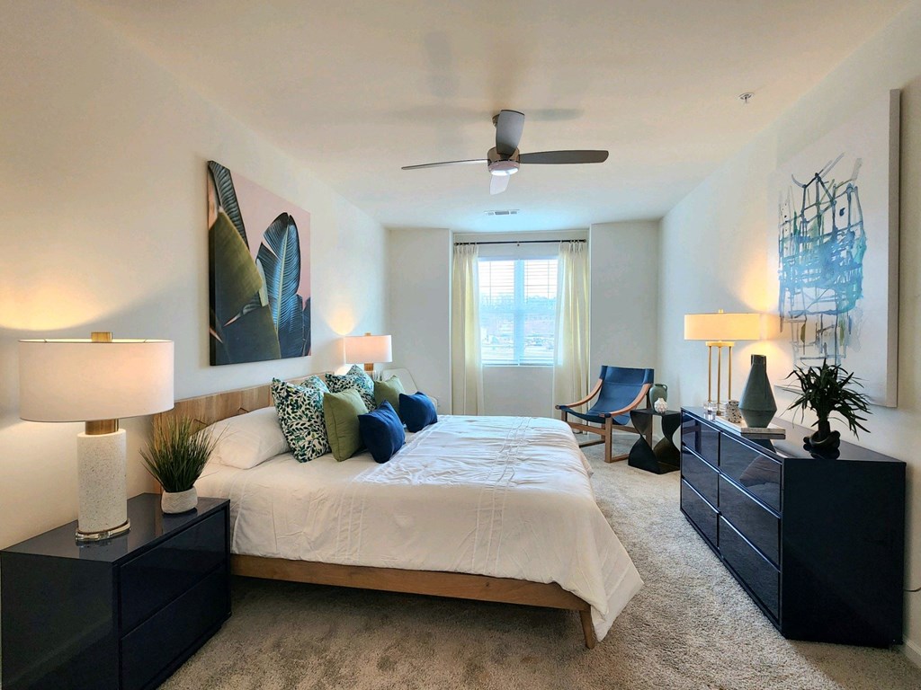 Bedroom with a large bed and a ceiling fan at Ardmore at Topside in Louisville, TN 37777