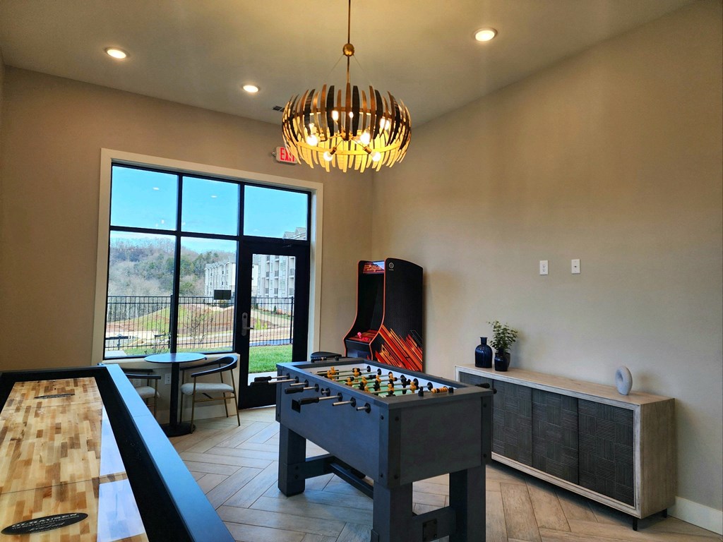 Game room with a foosball table and a fire place at Ardmore at Topside in Louisville, TN 37777