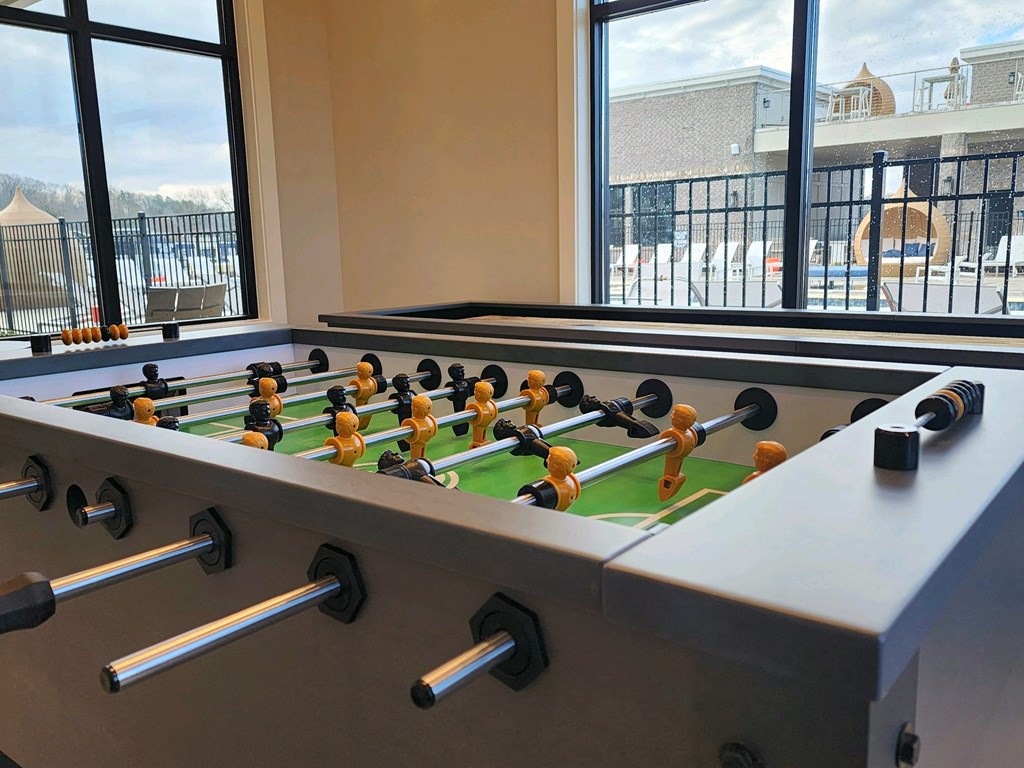 Foosball table in a room with a window at Ardmore at Topside in Louisville, TN 37777