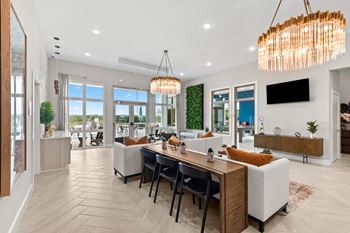 A modern dining room with a wooden table and chairs.