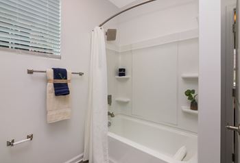a bathtub and shower in a 555 waverly unit  at Ardmore at Bryton, Huntersville