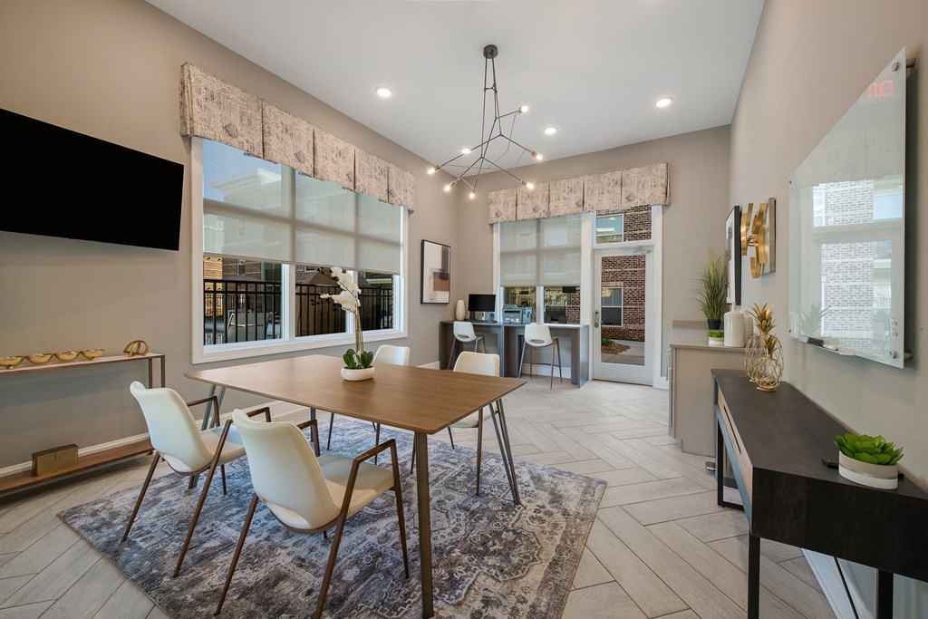 a dining room with a wooden table and chairs