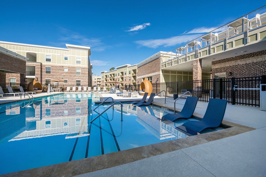 our apartments have a large pool with lounge chairs