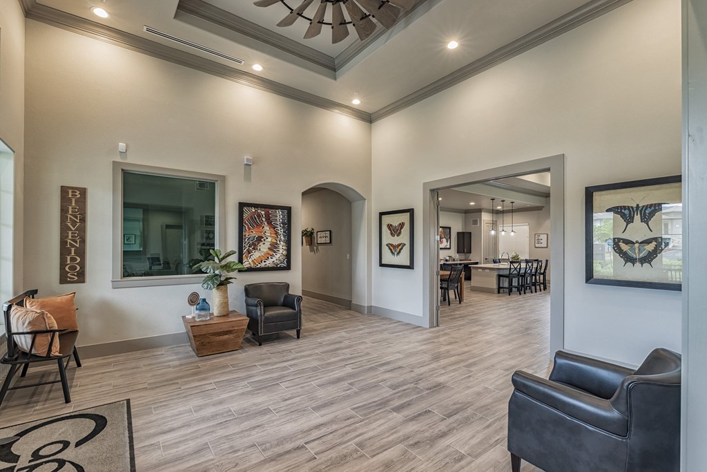 a living room with furniture and a ceiling fan