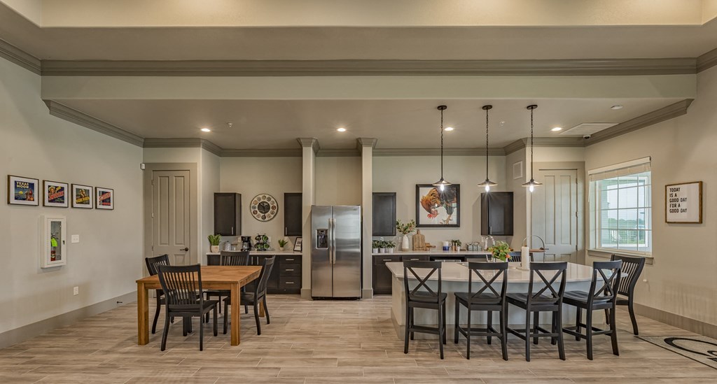 an open kitchen and dining room with a table and chairs