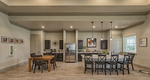an open kitchen and dining room with a table and chairs