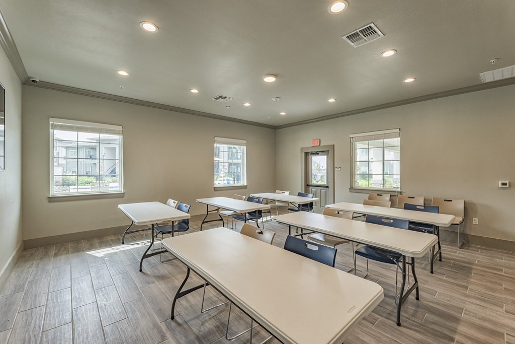a dining room with tables and chairs and a window