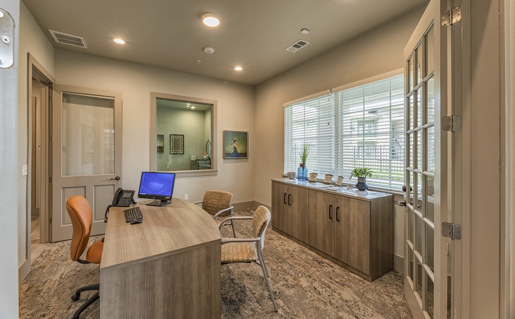 a home office with a desk and a computer