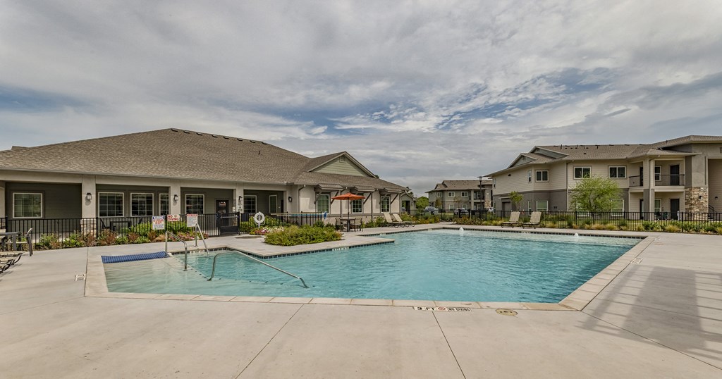 the preserve at ballantyne commons swimming pool with apartment buildings