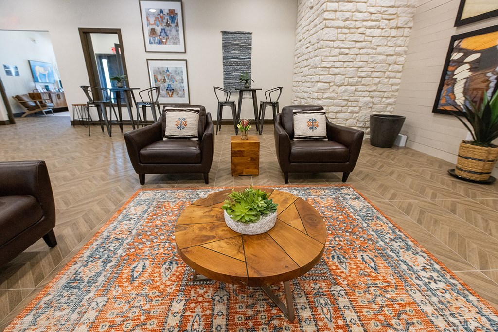a living room with chairs and a coffee table