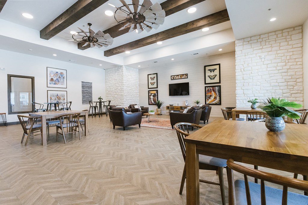 the dining room of our apartments atrium with tables and chairs