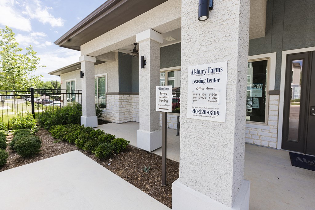 a white building with a sign on the front of it