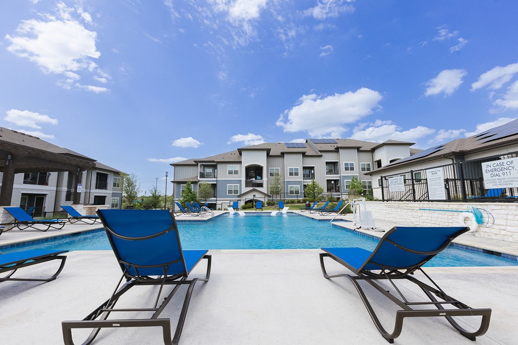 the preserve at ballantyne commons pool and lounge chairs with apartment buildings