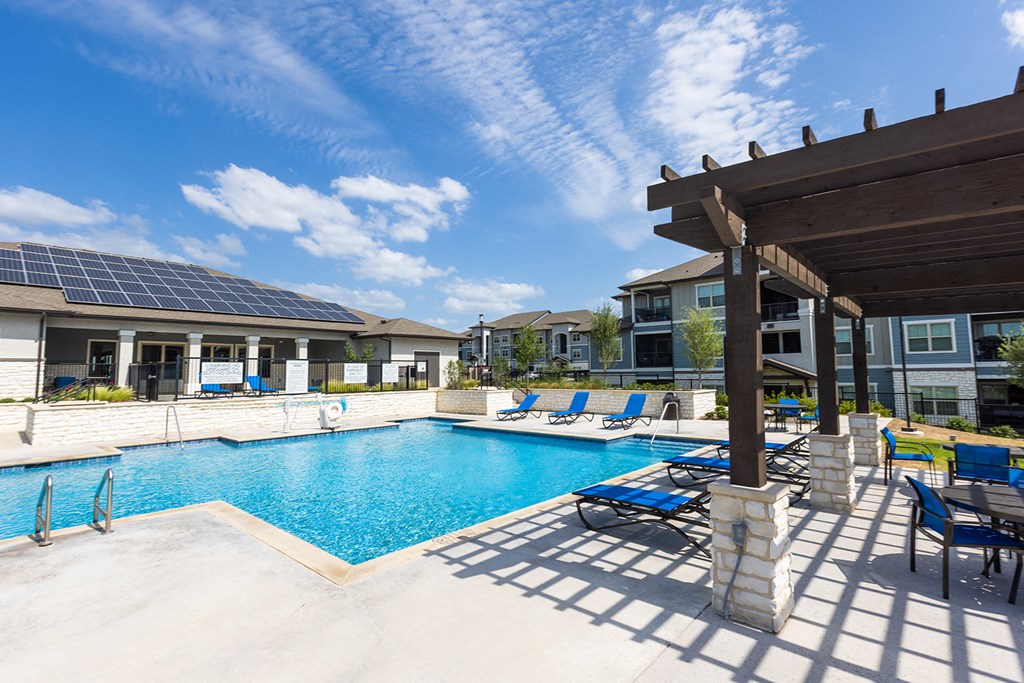 our apartments have a large swimming pool with lounge chairs