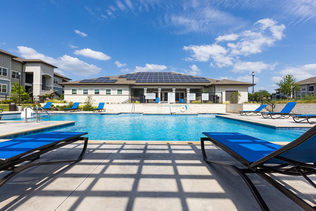 our apartments have a large swimming pool with lounge chairs