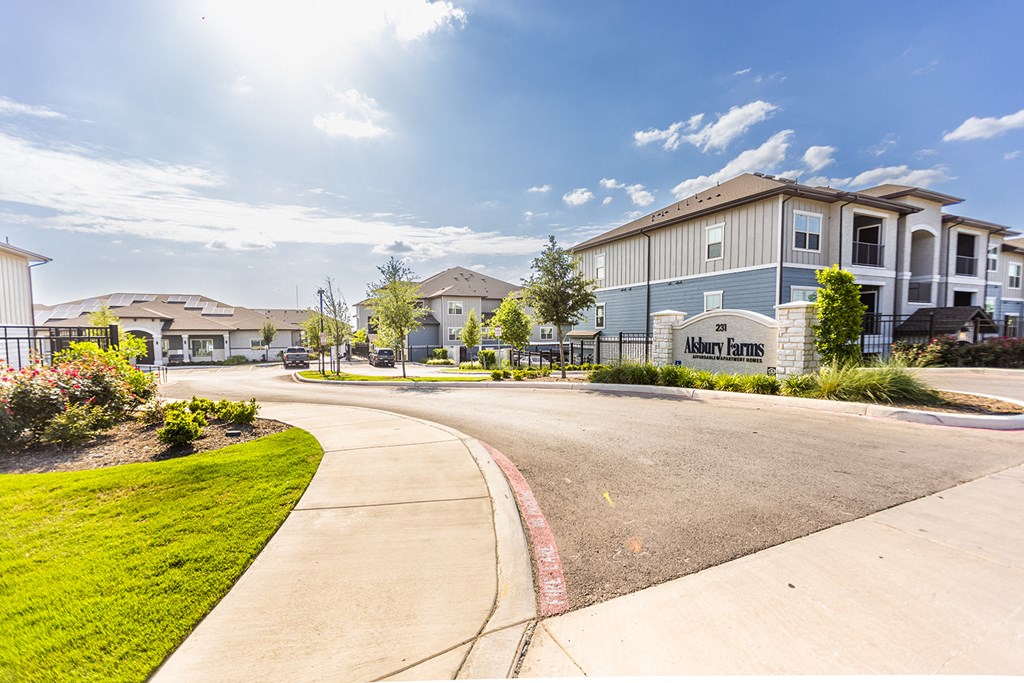 an empty street with houses on the side of it