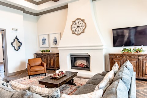 a living room with a couch and a fireplace