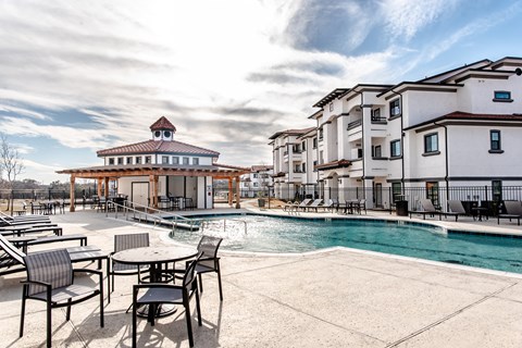 the swimming pool at the estates apartments