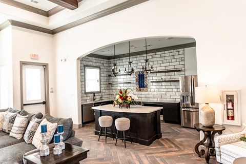 a living room with a kitchen and a couch