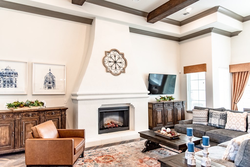 a living room with a couch and a fireplace