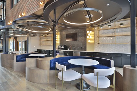 A modern interior with a curved ceiling and a bar area.
