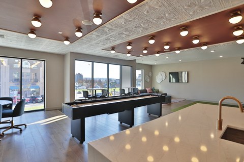A room with a piano and a sink.