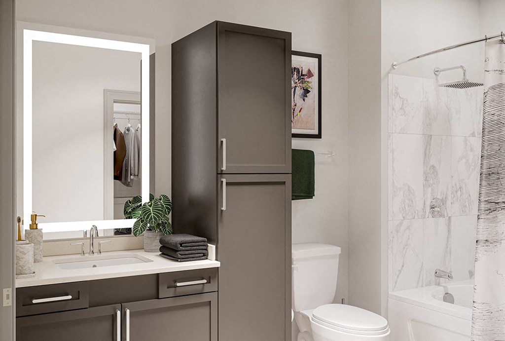 a bathroom with a sink and a toilet and a shower